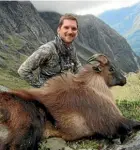  ??  ?? Baxter Roberson, of San Francisco, with a tahr he shot during a West Coast hunt in April 2016.