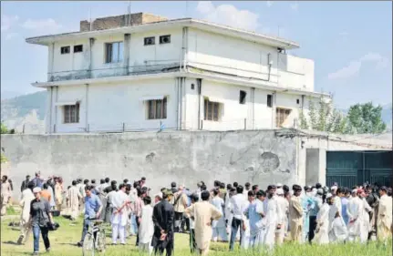  ?? AAMIR QURESHI/AFP ?? Outside the hideout of AlQaeda leader Osama bin Laden a couple of days after he was killed by US Special Forces in a ground operation in Abbottabad on May 1, 2011. As the authors of The Exile write in the accompanyi­ng piece, the villa was the scene of...