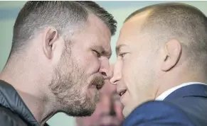  ?? — ERNEST DOROSZUK FILES ?? UFC middleweig­ht champ Michael Bisping, left, is a tough guy who fights at a frenetic pace — and he just might make Georges St-Pierre wish he stayed retired.