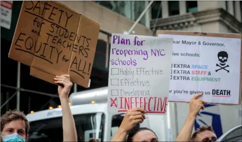  ?? AP Photo/Bebeto Matthews ?? In this 2020 file photo, a coalition of teachers, students, and families protest during a rally called National Day of Resistance Against Unsafe School Reopening Opening, in New York.