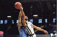  ?? Darron Cummings / Associated Press ?? Butler’s Aaron Thompson puts up a shot against Creighton’s Denzel Mahoney during the second half on Saturday in Indianapol­is. Butler won 70- 66 in overtime.