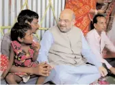  ?? — PTI ?? BJP president Amit Shah having lunch at Raju Mahali’s house at Dakkhin Katiajote village in Naxalbari, West Bengal, on on April 25.