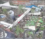  ?? ?? An abandoned tabletop football set in the front garden