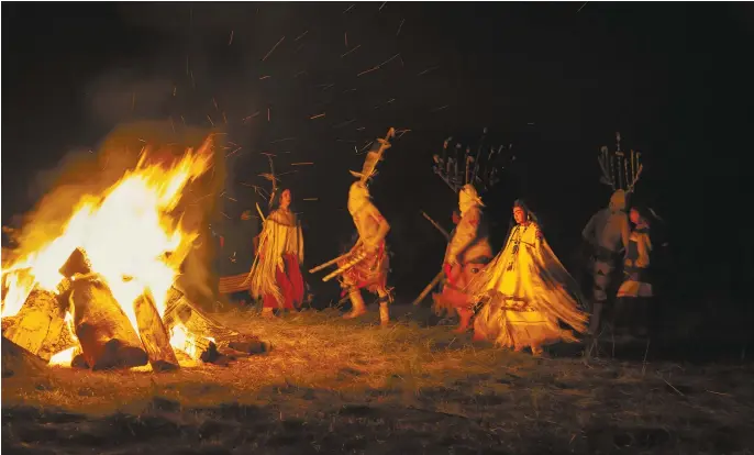  ??  ?? Malia Enjady dances with the Crown Dancers (Gahe Dancers) around a campfire (detail, 2014), photo Jan Butchofsky; below, Jan Butchofsky, photo Mark Berndt