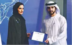  ?? Arshad Ali/Gulf News ?? Shaikh Hamdan presents the Certificat­e of Completion to Noor Al Falasi at Madinat Jumeirah yesterday.