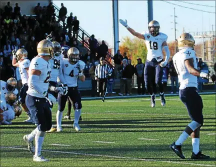  ?? COURTESY JOHN CARROLL UNIVERSITY ?? Kirtland graduate Scott Eilerman signals for a first down during John Carroll’s stunning 31-28 victory at Mount Union in November.