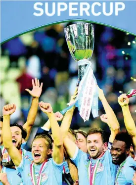  ?? AP ?? Lazio players celebrate after winning the Italian Super Cup against Juventus at King Saud University Stadium, in Riyadh, Saudi Arabia, yesterday.