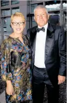  ??  ?? Restaurant Brands’ Russel Creedy, with wife Linda Creedy, was crowned Chief Executive of the Year.