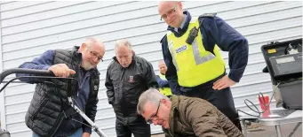  ??  ?? Pat McGeever having his property marked by the new Telesis machine by crime prevention officer Jim Fox, also present in photograph Sergent Terry McMahon and Cllr Seamus Kilgannon.