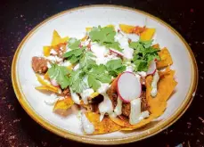  ?? Cesar Hernandez/The Chronicle ?? Frito pie is one of the main attraction­s, a nod to nostalgic joy.