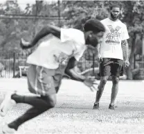  ?? Karen Warren / Houston Chronicle ?? Xavien Howard watches drills during the Xavien Howard Football Camp at Wheatley on Saturday. Howard, a Wheatley grad now with the Dolphins, is giving back to his community.