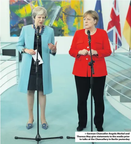  ??  ?? > German Chancellor Angela Merkel and Theresa May give statements to the media prior to talks at the Chanceller­y in Berlin yesterday