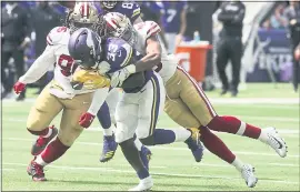  ?? JIM MONE — ASSOCIATED PRESS ?? Rookie linebacker Fred Warner, right, knocks the ball out of the hands of Vikings running back Dalvin Cook. Warner had 12 tackles to go along with the forced fumble in the loss.