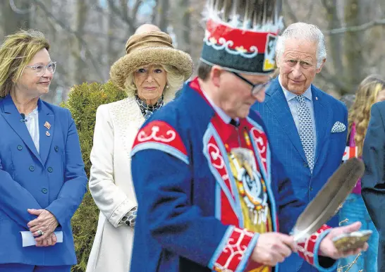  ?? KEITH GOSSE • THE TELEGRAM ?? Prince Charles and Camilla, Duchess of Cornwall, look on during a smudging ceremony at the Heart Garden on Government House grounds in St. John’s Tuesday, May 17, during Royal Visit 2022. At left is Lt.-gov. Judy Foote.