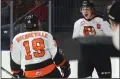  ?? NEWS PHOTO RYAN MCCRACKEN ?? Medicine Hat Tigers captain Mark Rassell celebrates with teammate David Quennevill­e after scoring his 50th goal of the season March 9.