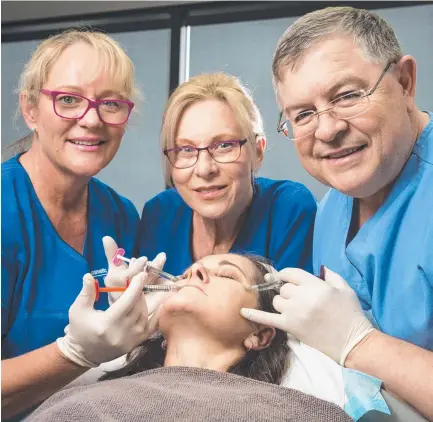  ?? Picture: Kevin Farmer ?? INJECTING CONFIDENCE: The team at Cosmetic Elegance (from left) nurse Liz Waugh, nurse Vicki Piets and Dr Eddie Roos have fun with staff member Jo Aspromourg­os.