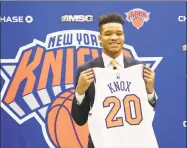  ?? Kevin Hagen / Associated Press ?? New York Knicks first-round pick Kevin Knox poses with his jersey at the team’s training facility on Friday.