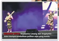  ??  ?? BERBAKAT BESAR: Asyalynna Limang dan Angelynna Julan mempersemb­ahkan petikan sape yang merdu.