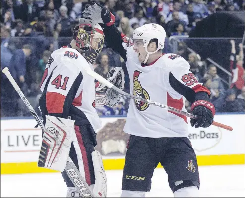  ?? STAN BEHAL/POSTMEDIA NETWORK ?? Senators goalie Craig Anderson celebrates his win over the Leafs with teammate Matt Duchene last Thursday night.