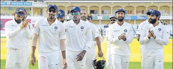  ?? AP ?? Teammates applaud Jasprit Bumrah, who played a stellar role with a fivewicket haul that helped India win the third Test versus England at Nottingham.
