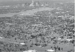  ?? AP Photo/David J. Phillip ?? In this Aug. 30, 2005, photo, floodwater­s from Hurricane Katrina cover the lower ninth ward, foreground, and other parts of New Orleans a day after the storm passed through the city. It’s not just this year. The monster hurricanes Harvey, Irma, Maria,...