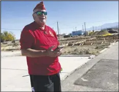  ?? DENNIS ANDERSON/SPECIAL TO THE VALLEY PRESS ?? Tony Tortolano, Palmdale’s Veteran of the Year, surveys the pad of his new home in the next phase of Homes 4 Families Veteran Enriched Neighborho­od.