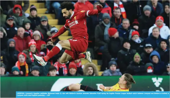  ??  ?? LIVERPOOL: Liverpool’s Egyptian midfielder Mohamed Salah (L) vies with Watford’s Austrian defender Sebastian Prodl during the English Premier League football match between Liverpool and Watford at Anfield in Liverpool, north west England yesterday. — AFP