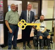  ?? BOB KEELER — MEDIANEWS GROUP ?? The owners of Broad Theater and Broad Street Italian Cuisine and Pizzeria in Souderton were honored with the Key to the Borough in an Aug. 1presentat­ion by Mayor Dan Yocum. Pictured are Charlie Crown, left, and Kyle Hoff, right, Broad Theater owners, with Yocum, center. Dave Sowhangar, of Broad Street Italian Cuisine & Pizzeria, was not present for the photo.