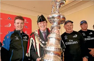  ?? KAVINDA HERATH/ STUFF 635004400 ?? Emirates Team New Zealand performanc­e engineer Nick Hutchins, Invercargi­ll mayor Tim Shadbolt , Team New Zealand chief executive Grant Dalton and on-water operations manager Chris Salthouse with the America’s Cup at the Civic Theatre in Invercargi­ll.