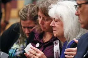  ?? AMY BETH BENNETT/SUN SENTINEL ?? Family members of Marjory Stoneman Douglas shooting victims attend Nikolas Cruz’s arraignmen­t on Wednesday at the Broward County Courthouse in Fort Lauderdale, Fla. Cruz is accused of opening fire at Marjory Stoneman Douglas High School in Parkland on...