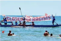  ?? C-Star, AP ?? People hold banners as they take protest against the scheduled arrival of the in Catania, Sicily Island. —