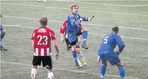  ?? John Rooney ?? Paul Carney rises to attempt to win a header for Widnes FC in their pre-season clash with Altrincham earlier this month.