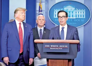  ??  ?? US Secretary of the Treasury Steve Mnuchin speaks during a press conference on the COVID-19, coronaviru­s, outbreak as Trump and US vice-president Mike Pence look on at the White House in Washington, DC.