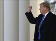  ?? AP PHOTO/SUSAN WALSH ?? President Donald Trump gestures to the audience Friday as he heads to the Oval Office after speaking during an event in the Rose Garden at the White House in Washington to declare a national emergency in order to build a wall along the southern border.