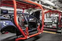  ?? CHRISTIE HEMM KLOK / THE NEW YORK TIMES ?? Tesla CEO Elon Musk wrote that he expects about one-third of shareholde­rs to take an offer of $420 per share, making the buyouts worth roughly $23.6 billion.