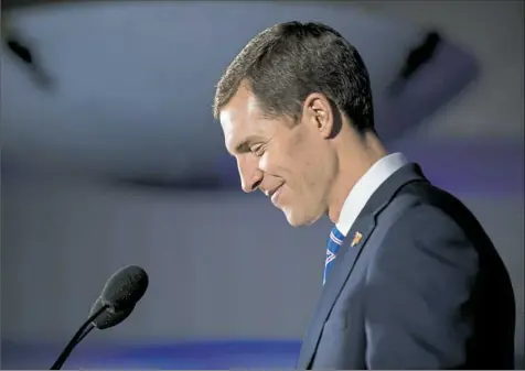  ?? Stephanie Strasburg/Post-Gazette ?? Conor Lamb takes the stage early Wednesday to deliver a declaratio­n of victory at the Hilton Garden Inn Southpoint­e in Washington County.