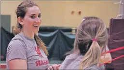  ?? KENN OLIVER/THE TELEGRAM ?? MUN women’s volleyball import Braxton Fenter chats with teammates during a practice at the Field House earlier this week. The middle position player from Vacacille, Calif., says she was immediatel­y intrigued by the prospect of attending Memorial and...