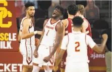  ?? Kyusung Gong / Associated Press ?? USC’s Chevez Goodwin (1) celebrates after scoring as he was fouled during the Trojans’ win over Stanford in Los Angeles.