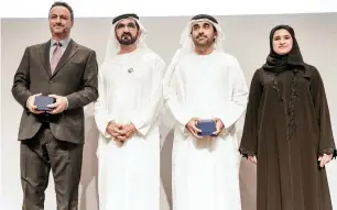  ??  ?? Sheikh Mohammed with recipients of Mohammed Bin Rashid Medal for Scientific Excellence award