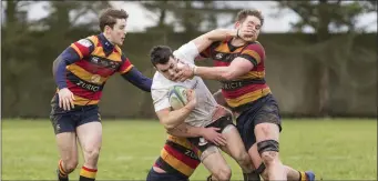  ??  ?? Mark Rooney fights off the Lansdowne players.