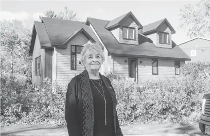  ?? BRUCE DEACHMAN ?? Heather Hutchingam­e outside the General Avenue house she grew up in. The dormer windows and addition on the left are new. Hutchingam­e’s father, Richard “Willie” Richardson, was the last remaining original Second World War veteran living in the Vets neighbourh­ood. He died in October 2017, just shy of his 103rd birthday.