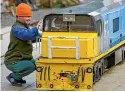  ??  ?? Owen Wildbore-brumby cleaning up the Dxrminiatu­re train engine in 2010 at Victoria Esplanade.