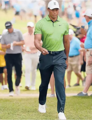  ?? EZRA SHAW/GETTY ?? Tiger Woods walks to the 14th hole during the second round of the PGA Championsh­ip on Friday.