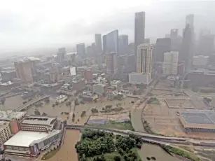  ?? ASSOCIATED PRESS FILE PHOTO ?? Highways around downtown Houston are empty as floodwater­s from Tropical Storm Harvey overflow from the bayous around the city in August.