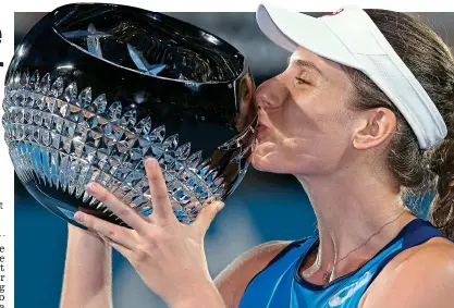  ?? AP ?? Having a ball: Jo Konta kisses the trophy after defeating Agnieszka Radwanska in the Sydney final