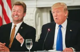  ?? THE ASSOICATED PRESS ?? President Donald Trump gestures toward Sen. Dean Heller, R-Nev., while speaking during a luncheon with GOP leadership on Wednesday in the State Dining Room of the White House in Washington.