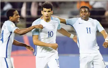  ??  ?? (L-R) England’s defender Kyle Walker-Peters, forward Dominic Solanke and forward Ademola Lookman celebrates a goal during the U-20 World Cup semi-final football match between England and Italy in Jeonju on June 8, 2017.