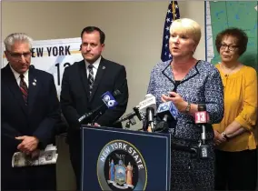  ?? GLENN GRIFFITH — MEDIANEWS GROUP FILE ?? Assemblywo­man Mary Beth Walsh discusses her opposition to the governor’s license plate proposal at a press conference earlier this month. Standing behind her, left to right, are Sen. Jim Tedisco, Saratoga County Clerk Craig Hayner, and Herkimer County Clerk Sylvia Rowan.