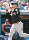  ?? RON SCHWANE/AP ?? Yasmani Grandal celebrates after hitting a solo home run off Cleveland pitcher Hunter Gaddis during the fourth inning on Thursday.