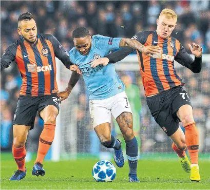  ?? ALEX DODD GETTY IMAGES ?? Manchester City’s Raheem Sterling, centre, is one of the most appreciate­d members of Pep Guardiola’s record-breaking side.